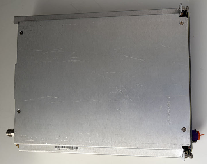 Metallic rectangular object with a label on a white background