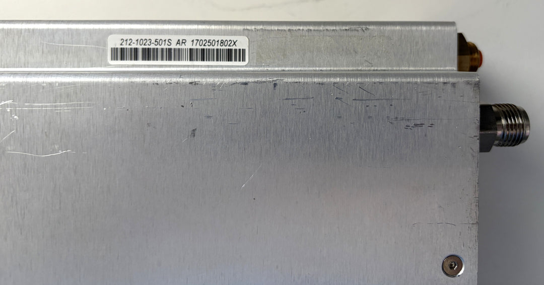 Metal electronic component with a label on a white background