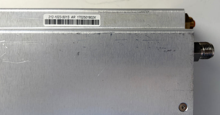 Metal electronic component with a label on a white background
