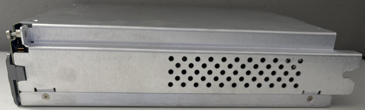 Metallic electronic device with cooling fins on a gray background
