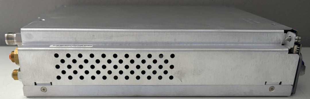 Metallic electronic device with cooling fins on a gray background