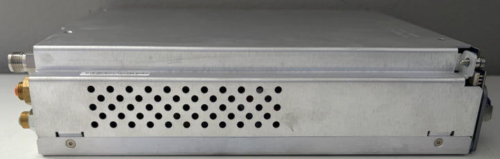 Metallic electronic device with cooling fins on a gray background