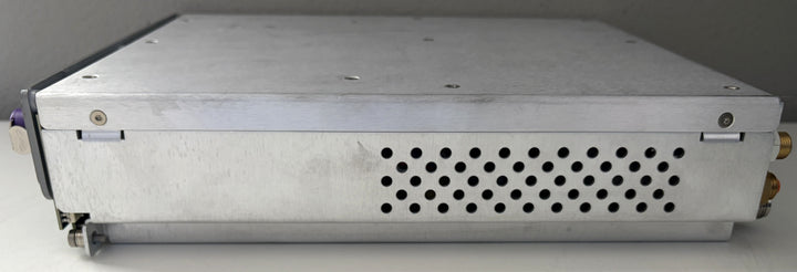 Metallic electronic device with cooling fins on a gray background