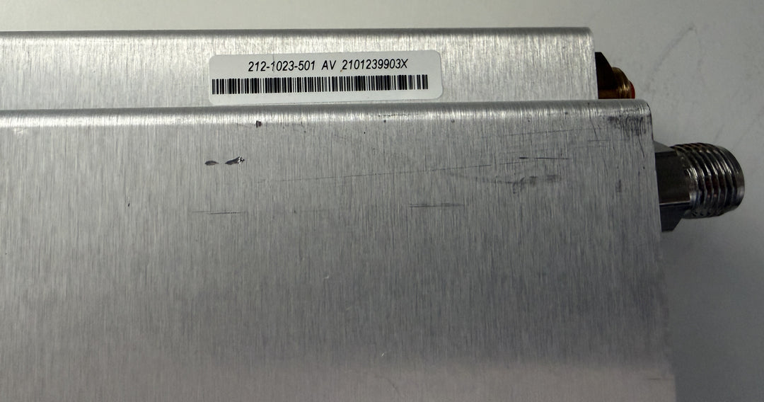 Metallic device with a label on a white background