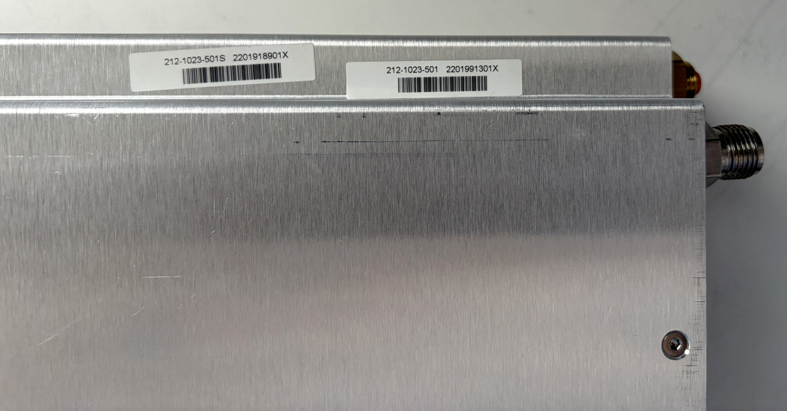 Metallic device with barcodes on a gray background