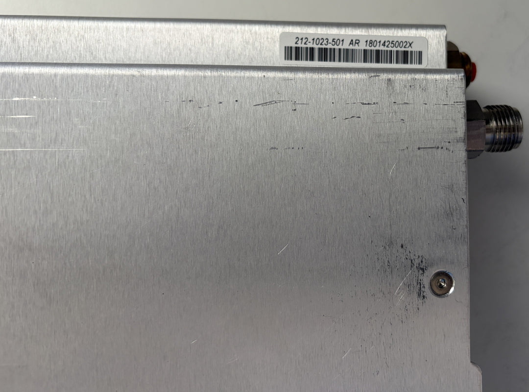 Metallic device with a barcode label on a gray background