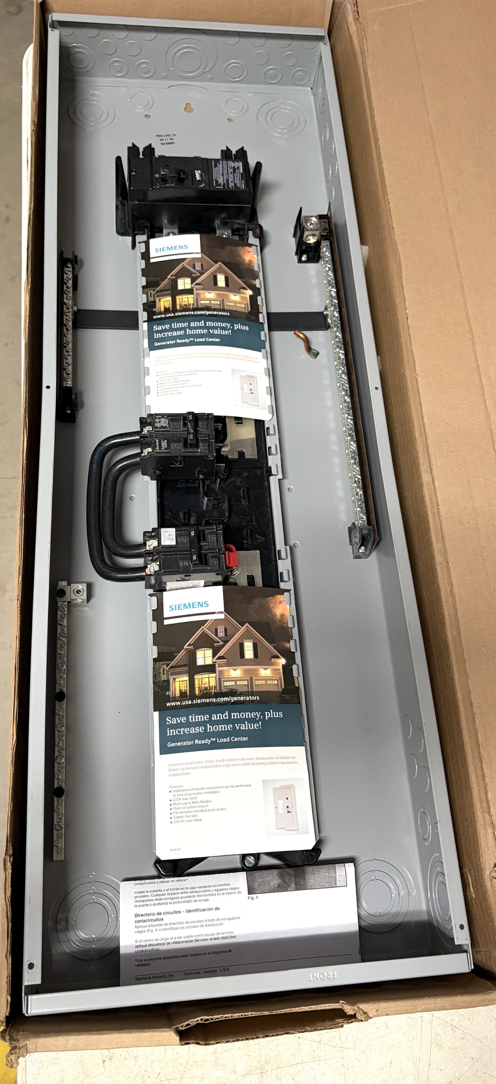 Siemens electrical load center panel with circuit breakers and bus bars, packaged in a cardboard box, designed for residential power distribution and generator readiness.