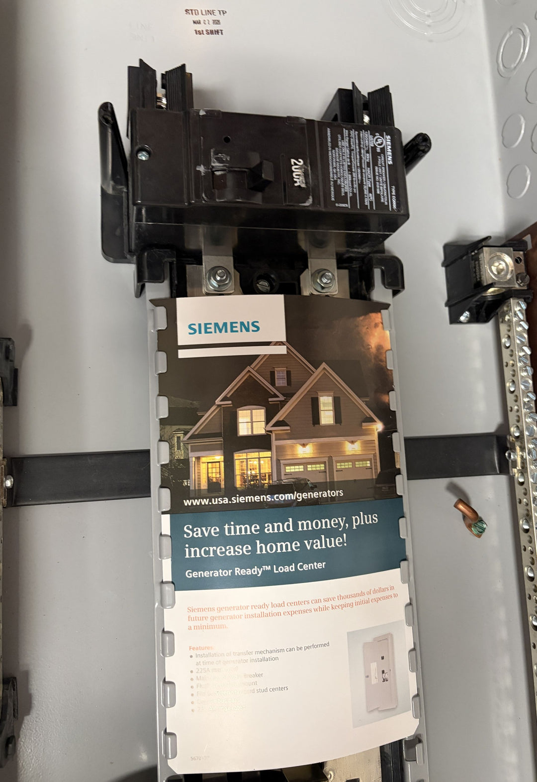 Siemens branded electrical load center with circuit breaker installed, featuring a product brochure highlighting generator ready capabilities for home backup power.