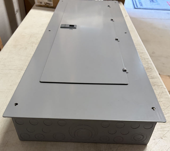 Siemens electrical load center with a gray metal cover and latch handle, designed for indoor use in electrical panel installations.