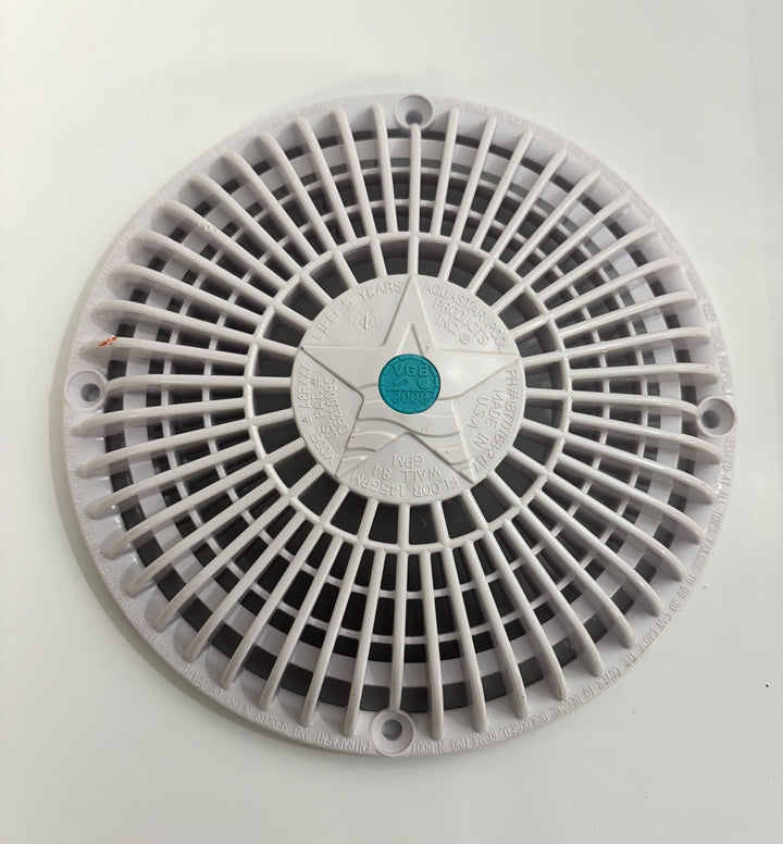 Round white pool suction outlet drain cover with a star design and AquaStar branding in the center, designed for safety and compliance with VGB-2008 standards.