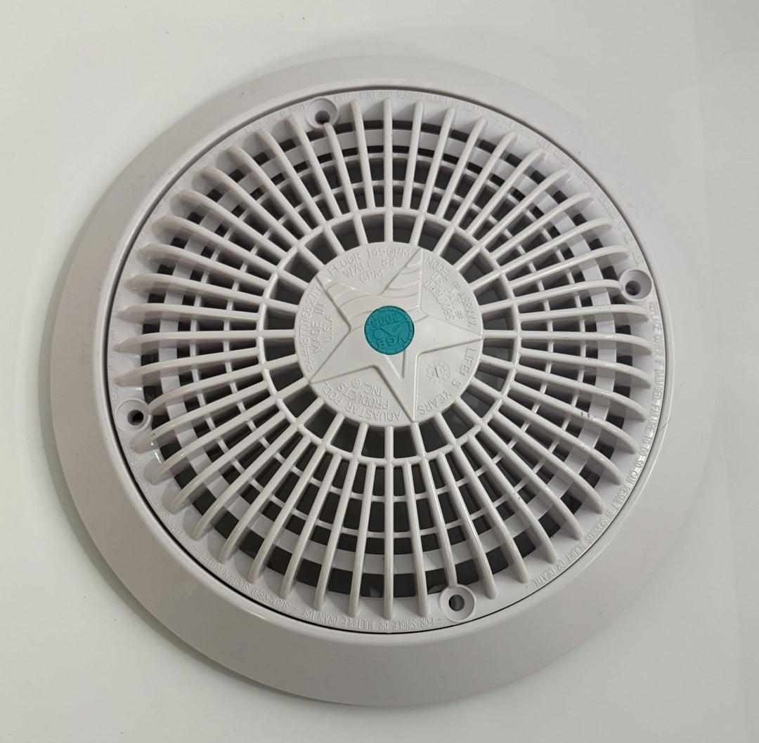 White circular pool suction outlet drain cover by AquaStar featuring a radial grid design with a central star-shaped pattern and a small blue logo in the center.