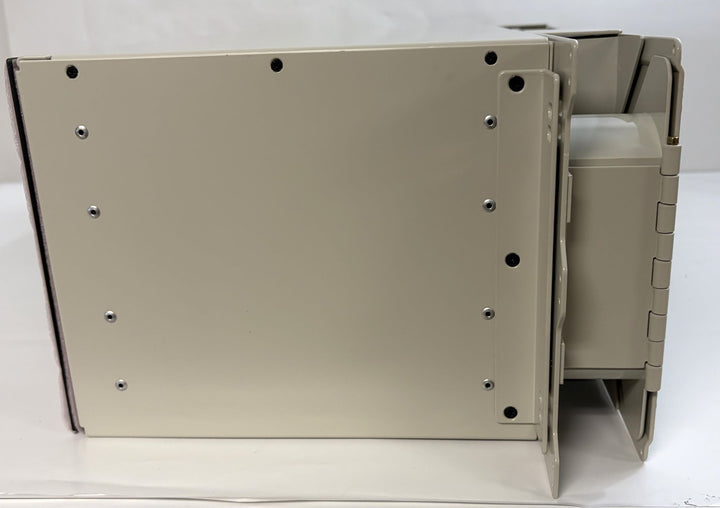 Side view of a beige TE Connectivity optical distribution frame chassis block new, featuring a sturdy metal construction, offered by PHENTERSALES for industrial applications.