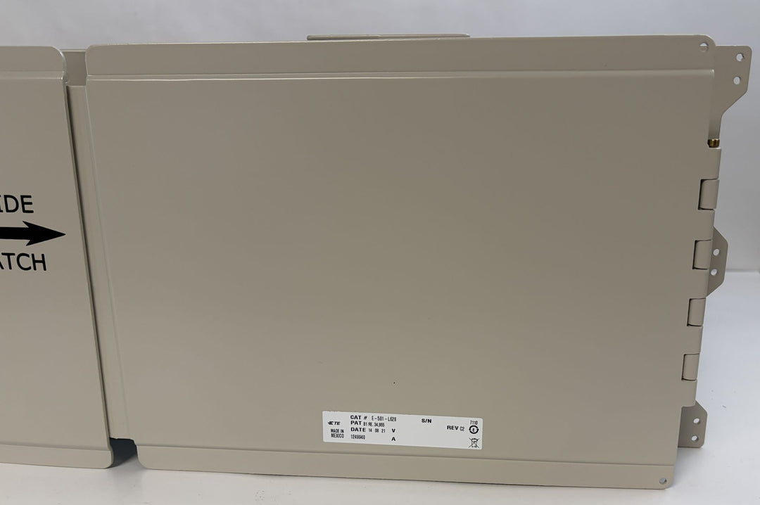 Light gray metal chassis block panel with mounting brackets and a small label, designed for industrial optical distribution applications by PHENTERSALES.