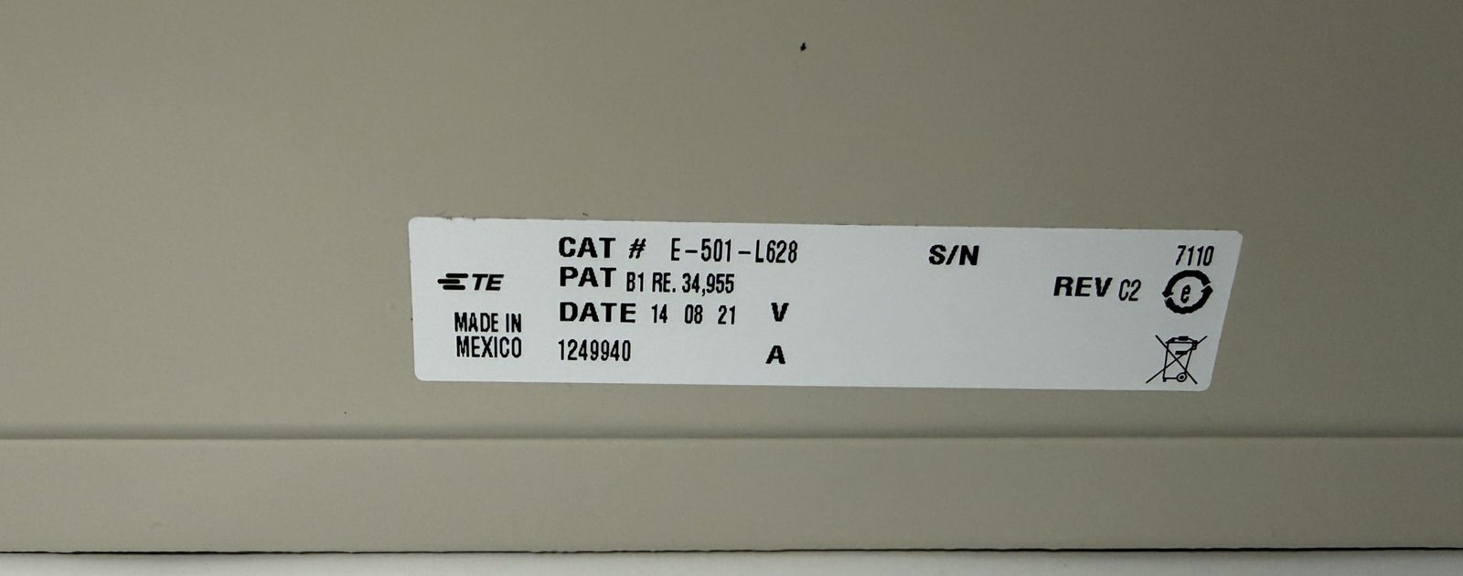 Close-up of a TE Connectivity label showing model number E-501-L628, patent information, manufacturing date, and origin from Mexico on an electrical chassis component offered by PHENTERSALES.