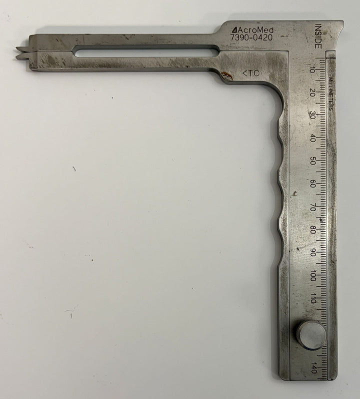 AcroMed stainless steel caliper spreader with engraved measurement scale and adjustable sliding arm, designed for precise pedicle distance measurement in medical applications.