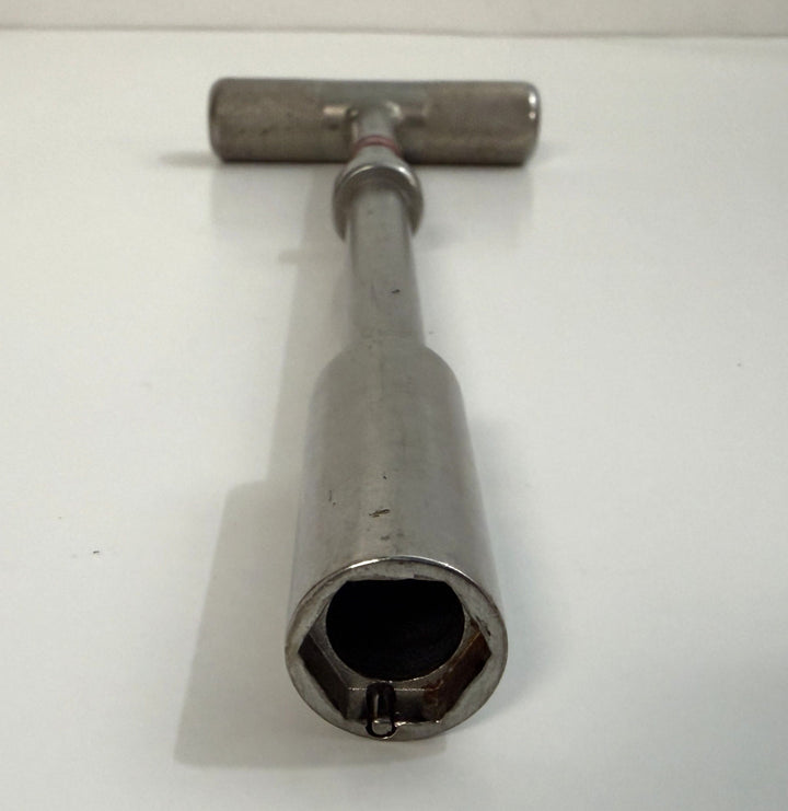 Stainless steel T-handle hex driver with hollow center and locking pin, designed for precise bolt extraction in industrial and medical applications by PHENTERSALES.