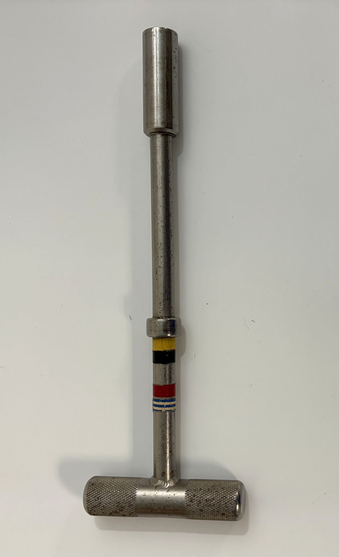 Metal T-handle hex driver with knurled grip and color-coded markings, designed for precision bolt extraction in orthopedic and industrial applications by PHENTERSALES.