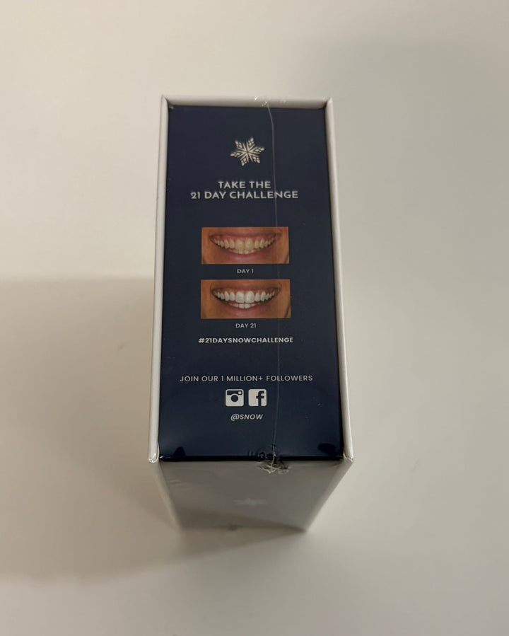 Side packaging of a Snow teeth whitening device box showing before and after photos from a 21-day challenge, with social media icons and follower invitation.