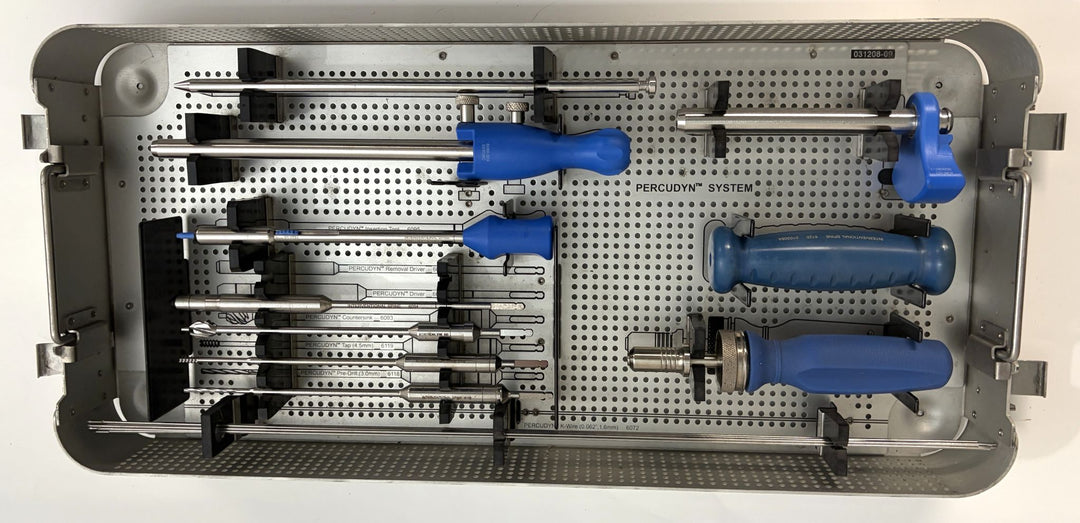 Sterilization tray neatly organized with surgical instruments from Interventional Spine featuring blue-handled tools designed for minimally invasive spine procedures.