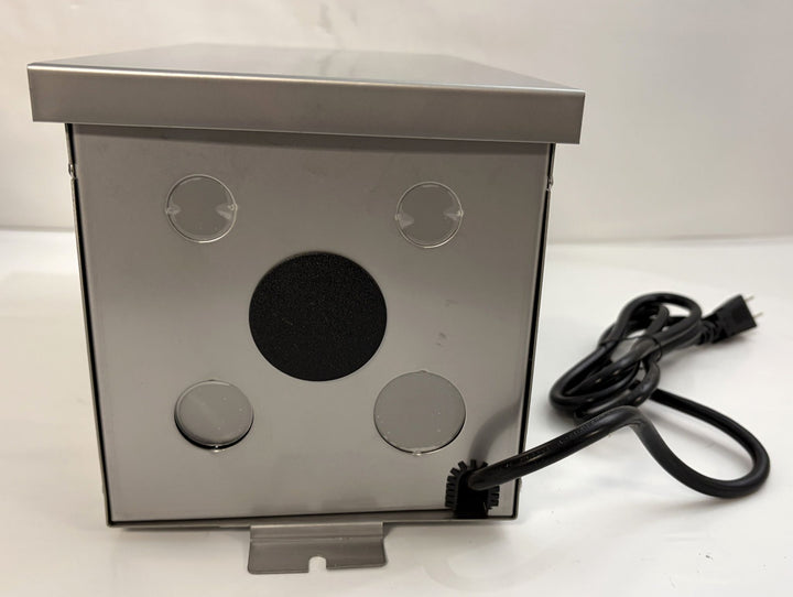 Stainless steel Dauer landscape transformer with mounting bracket and attached power cord, designed for outdoor electrical applications in commercial and residential settings.