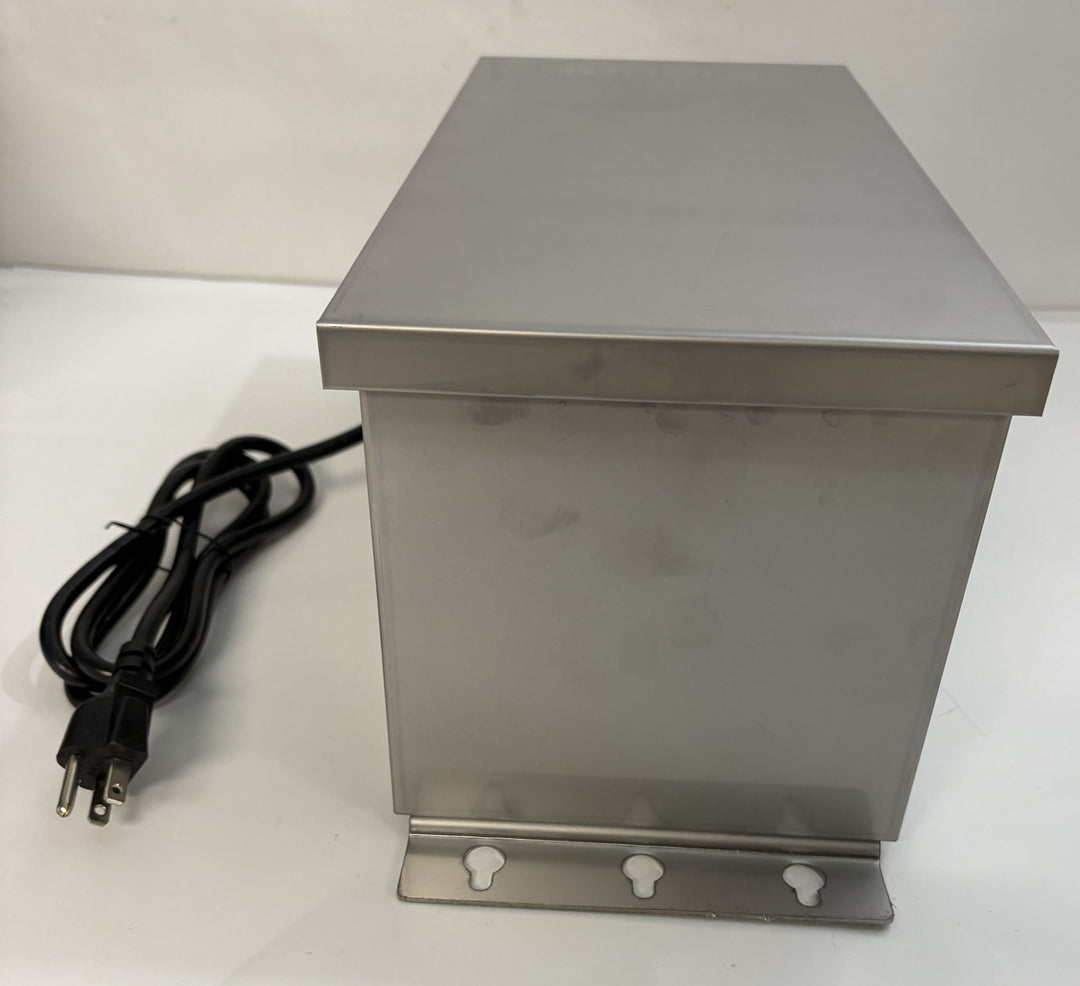 Stainless steel landscape transformer enclosure with attached power cord and mounting bracket, designed for outdoor electrical use by Dauer.