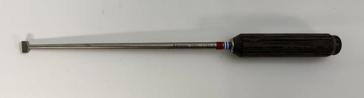 AcroMed bone graft impactor featuring a long metal shaft with a flat tip and a textured black handle, designed for precise spinal surgical procedures.