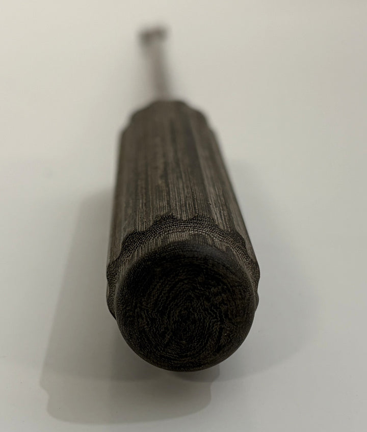 Close-up view of a textured dark handle on an AcroMed bone graft impactor, a precision spinal surgical instrument used in medical procedures.