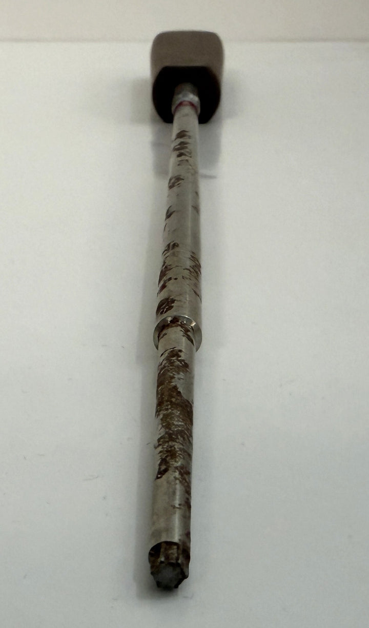Long metal spinal pedicle probe instrument with a worn surface and black handle, designed for precise surgical use, supplied by Depuy AcroMed.