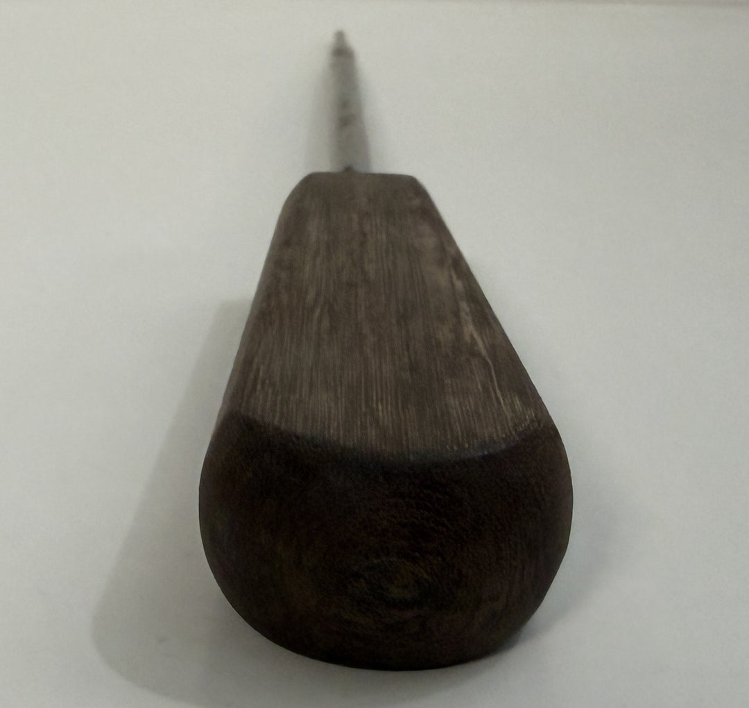 Close-up view of a DePuy AcroMed spinal pedicle probe instrument with a dark wooden handle and metallic pointed shaft, used in precision spinal procedures.