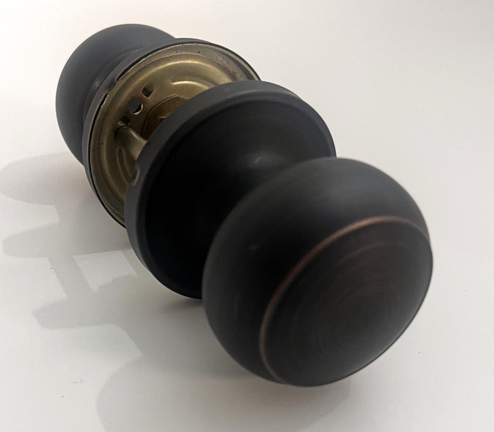 Oil-rubbed bronze Probrico privacy door knob handle with a classic round design for interior doors.