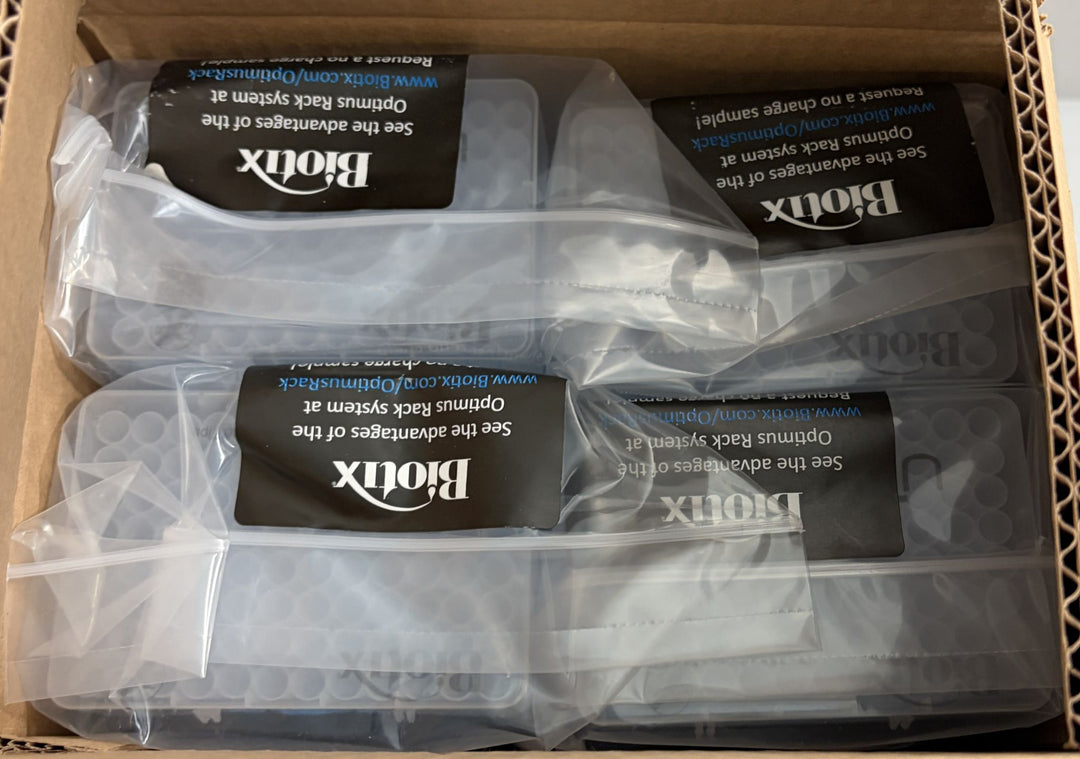 Box containing multiple clear plastic reload cases of Biotix pipette tips individually sealed in transparent packaging, suitable for laboratory use.