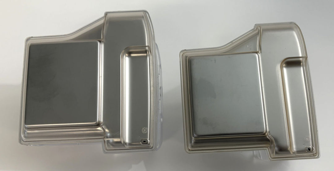Two clear replacement water chamber tubs with silver inner panels, designed for Resmed CPAP humidifiers, shown side by side on a white background.