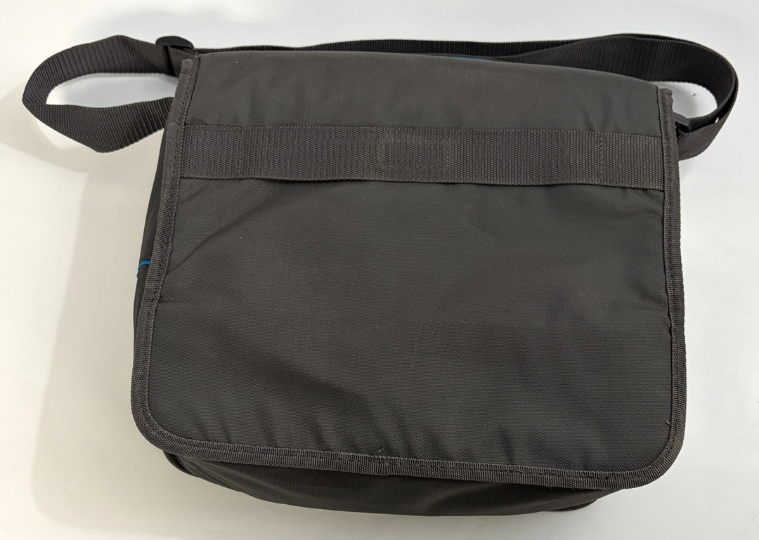 Charcoal gray Resmed fabric travel bag with adjustable shoulder strap, designed to carry CPAP equipment securely and conveniently.
