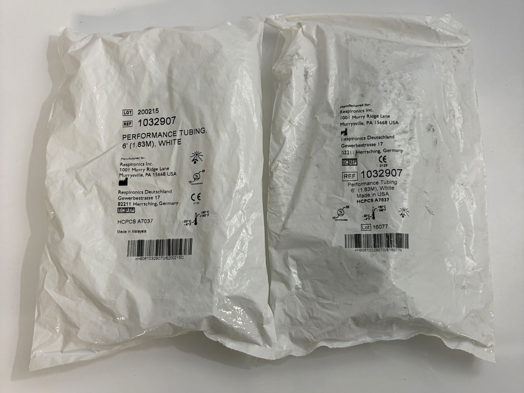 Two white sealed plastic packages containing Respironics performance tubing measuring 6 feet, labeled with product details and barcodes on the outside.