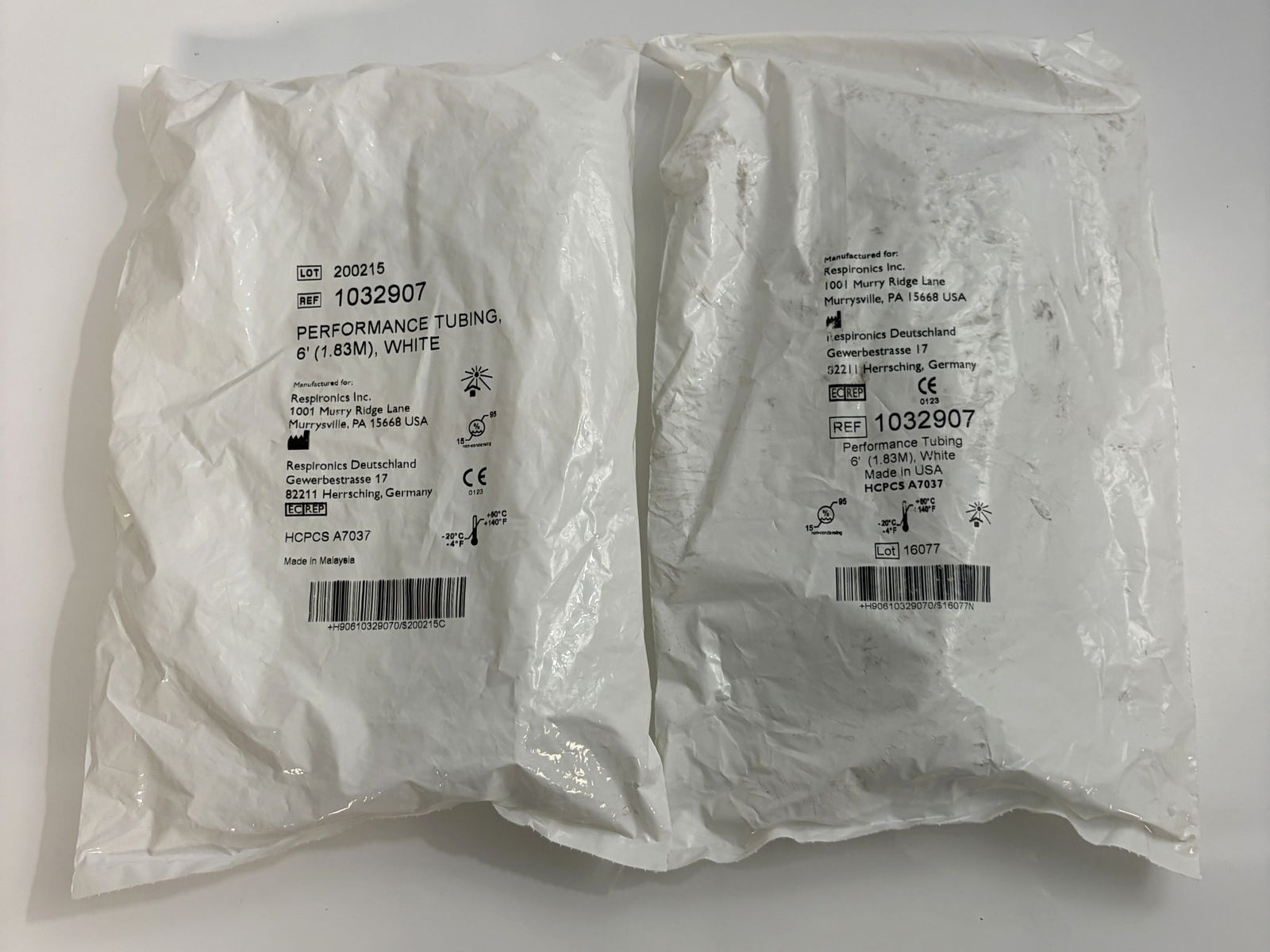 Two white sealed plastic packages containing Respironics performance tubing measuring 6 feet, labeled with product details and barcodes on the outside.
