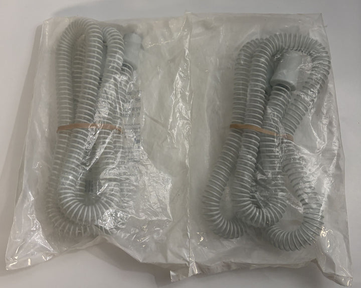 Pair of coiled gray Respironics CPAP tubing pieces in sealed clear plastic packaging, designed for medical respiratory therapy use.