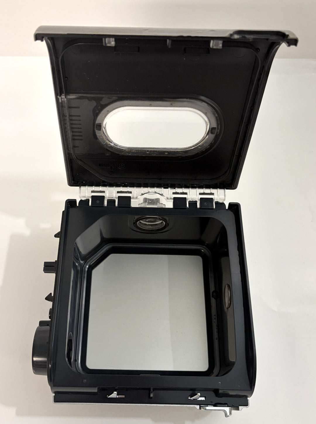 Open black plastic humidifier water chamber with clear window on the lid, designed as a replacement part for a Resmed CPAP device, shown on a white background.
