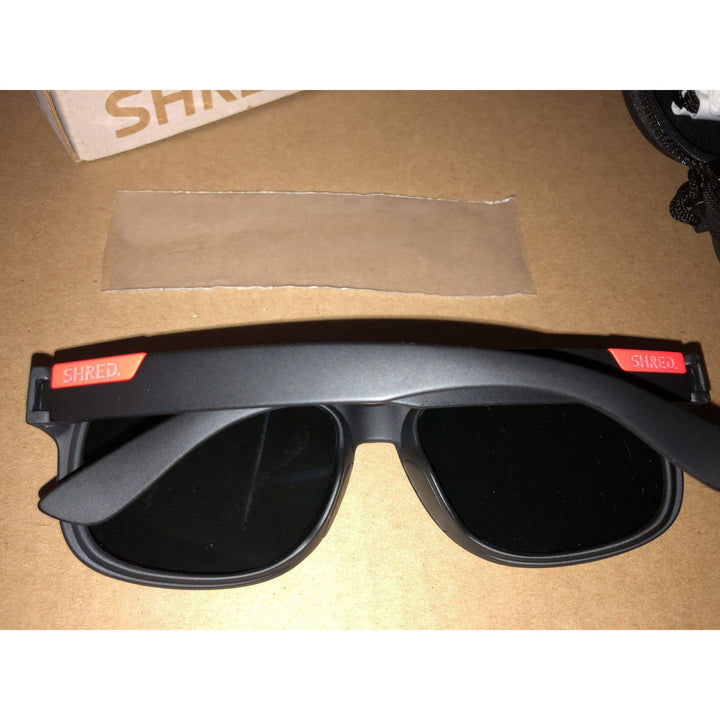 Shred black/rust men's sunglasses with STOMP mirror CBL polarized lenses, durable and stylish, crafted in Italy for superior clarity.