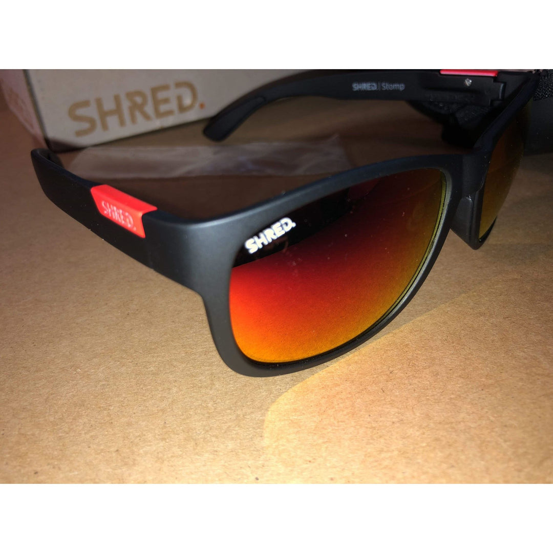 Shred black/rust men's sunglasses with STOMP mirror CBL polarized lenses, durable and stylish, crafted in Italy for superior clarity.