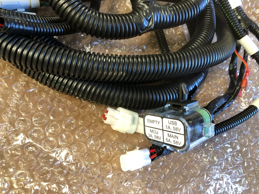 New Yamaha J5A-H2590-10-00 wire harness assembly with black protective conduit and labeled electrical connectors for a golf cart
