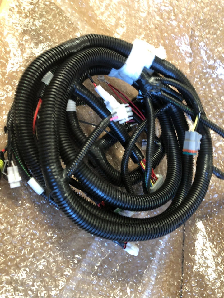 New Yamaha OEM J5A-H2590-10-00 wire harness assembly with black protective conduit and multiple electrical connectors for a golf cart