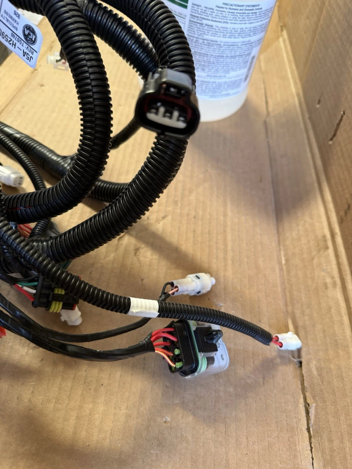 New Yamaha J5A-H2590-10-00 wire harness assembly with black corrugated protective sleeving and multiple electrical connectors for a golf cart