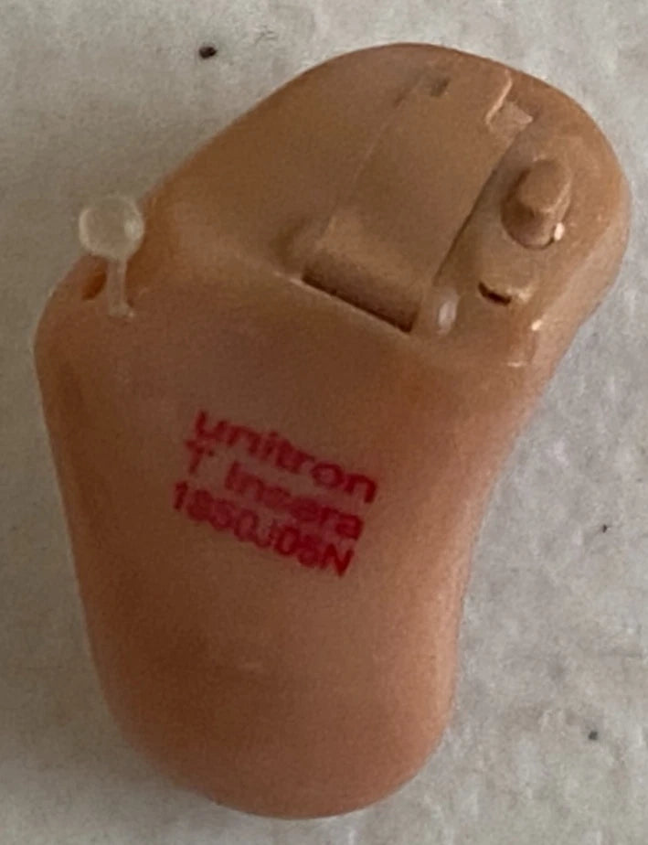 Tan Unitron T Insera in-ear hearing aid with visible controls and red markings, a medical assistive device sold by PHENTERSALES