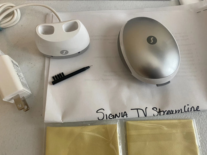 Two electronic devices on a white surface with &