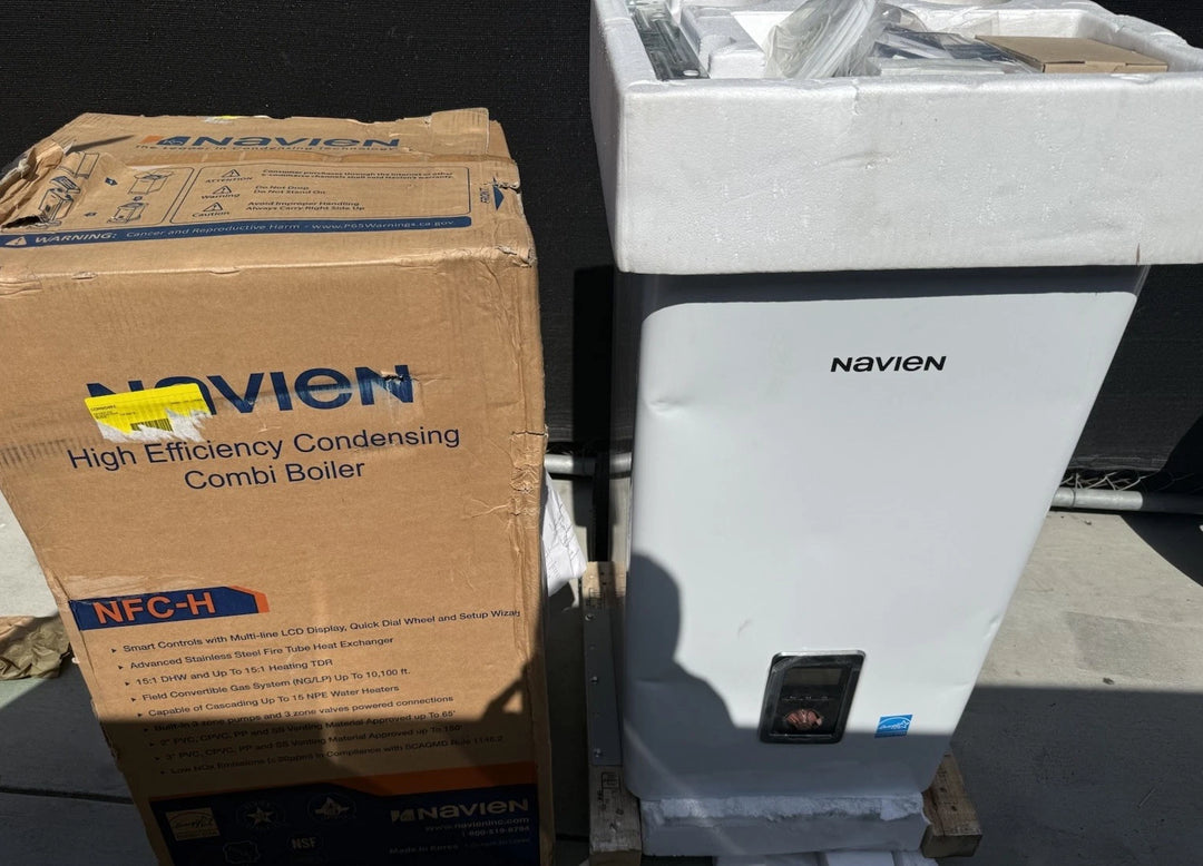 Navien high efficiency condensing combi boiler beside its cardboard packaging, with a white casing and front control panel visible