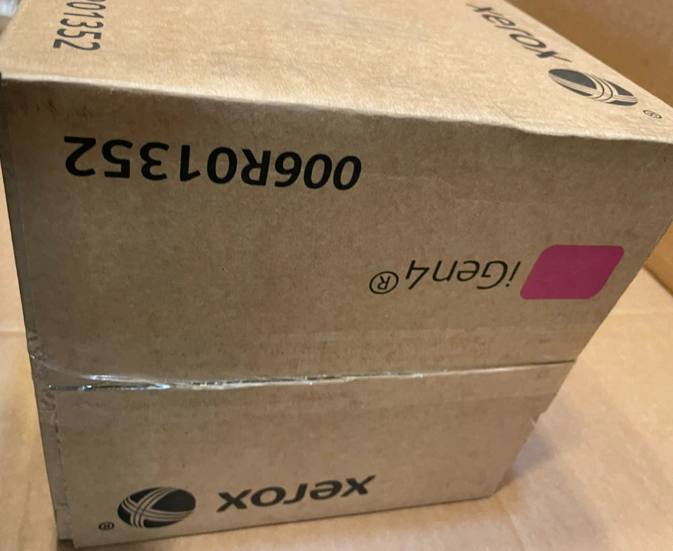Brown cardboard box labeled with a magenta color swatch and model number 006R01352 containing a Xerox iGen4 ink toner cartridge from PHENTERSALES displayed on a plain surface.