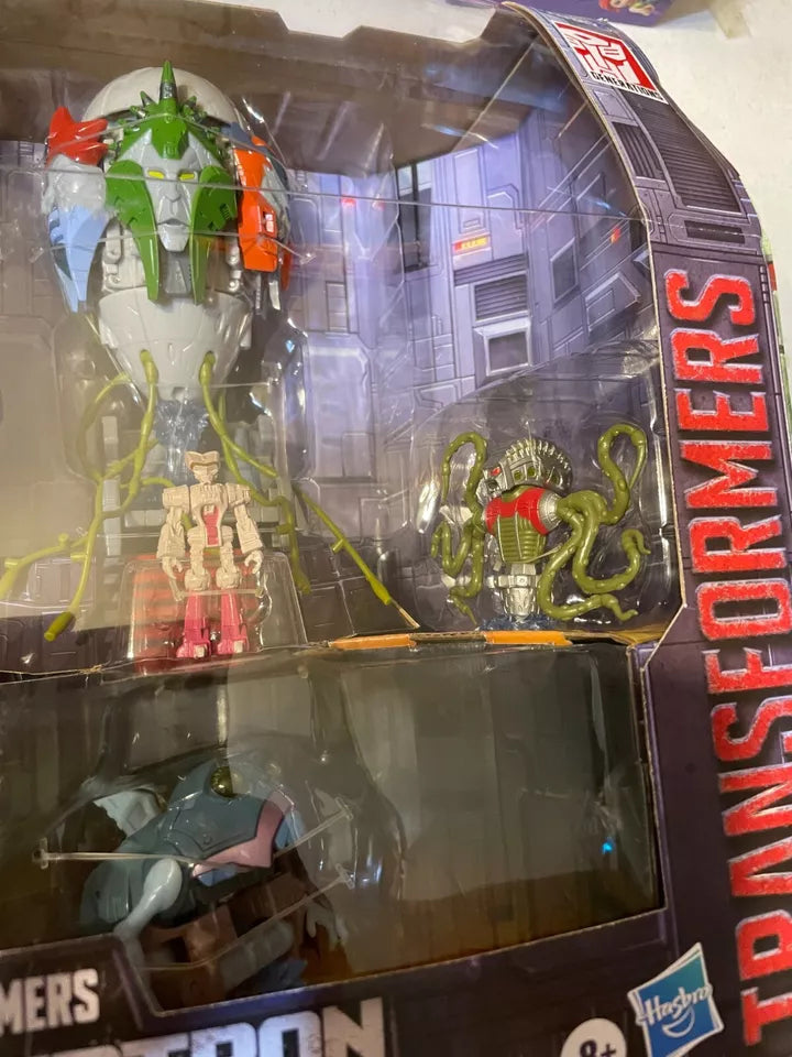 Hasbro Transformers Quintesson Pit of Judgement SDCC exclusive action figure set, featuring iconic characters, detailed and highly collectible.