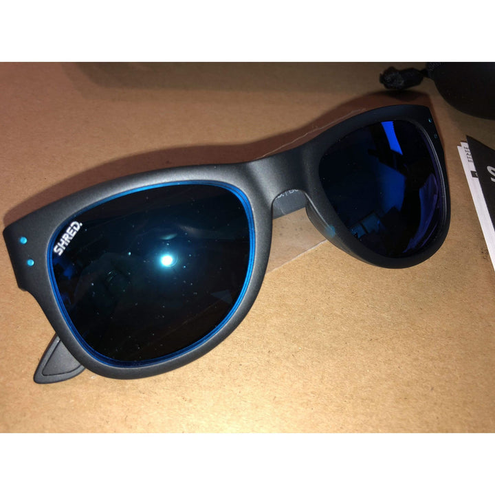 Shred Belushki black men's sunglasses with blue mirror polarized lenses, stylish design, and quality craftsmanship made in Italy.