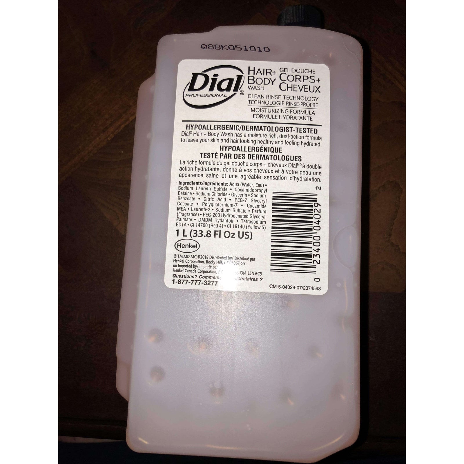 Dial Hair + Body Wash refill for 1L liquid dispenser, featuring a refreshing peach scent for a clean and invigorating experience.